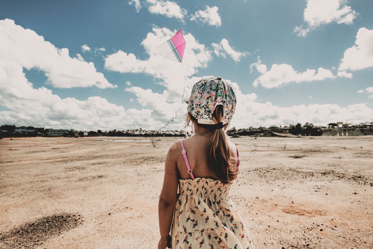 child flying a kite